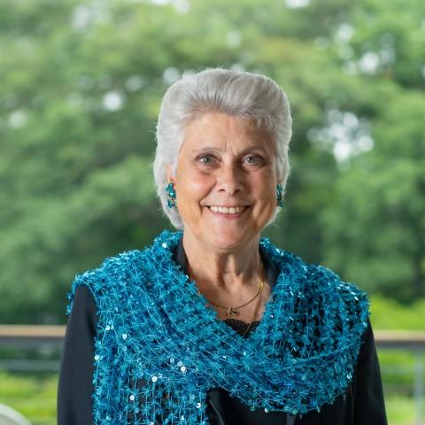 Portrait of Marilyn Gugliucci against trees on the Biddeford Campus